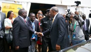 Kivumbi Earnest Benjamin with Prime Minister Dr Ruhaka Rugunda (1)